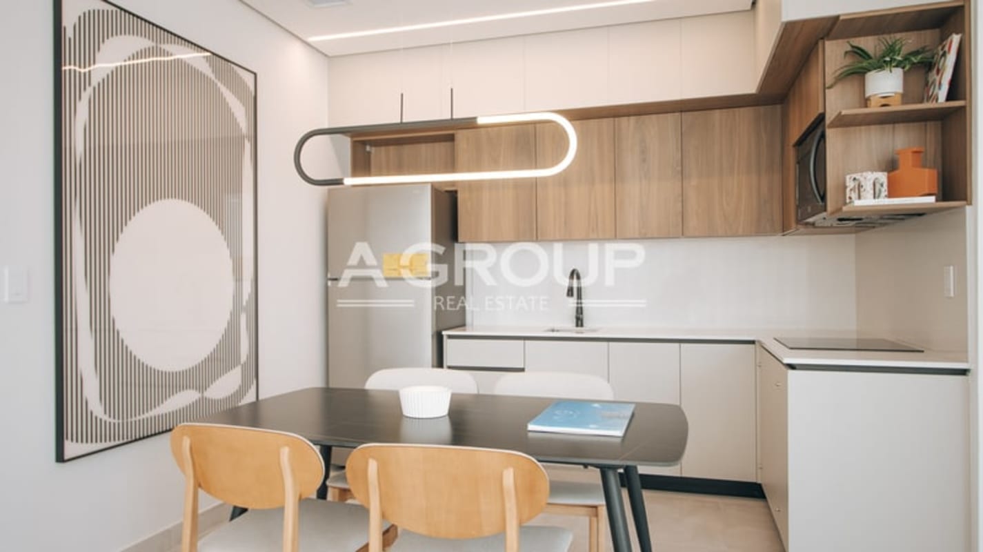 Open modern kitchen with white cabinetry, integrated appliances in Generation Tower Costa del Este Panama