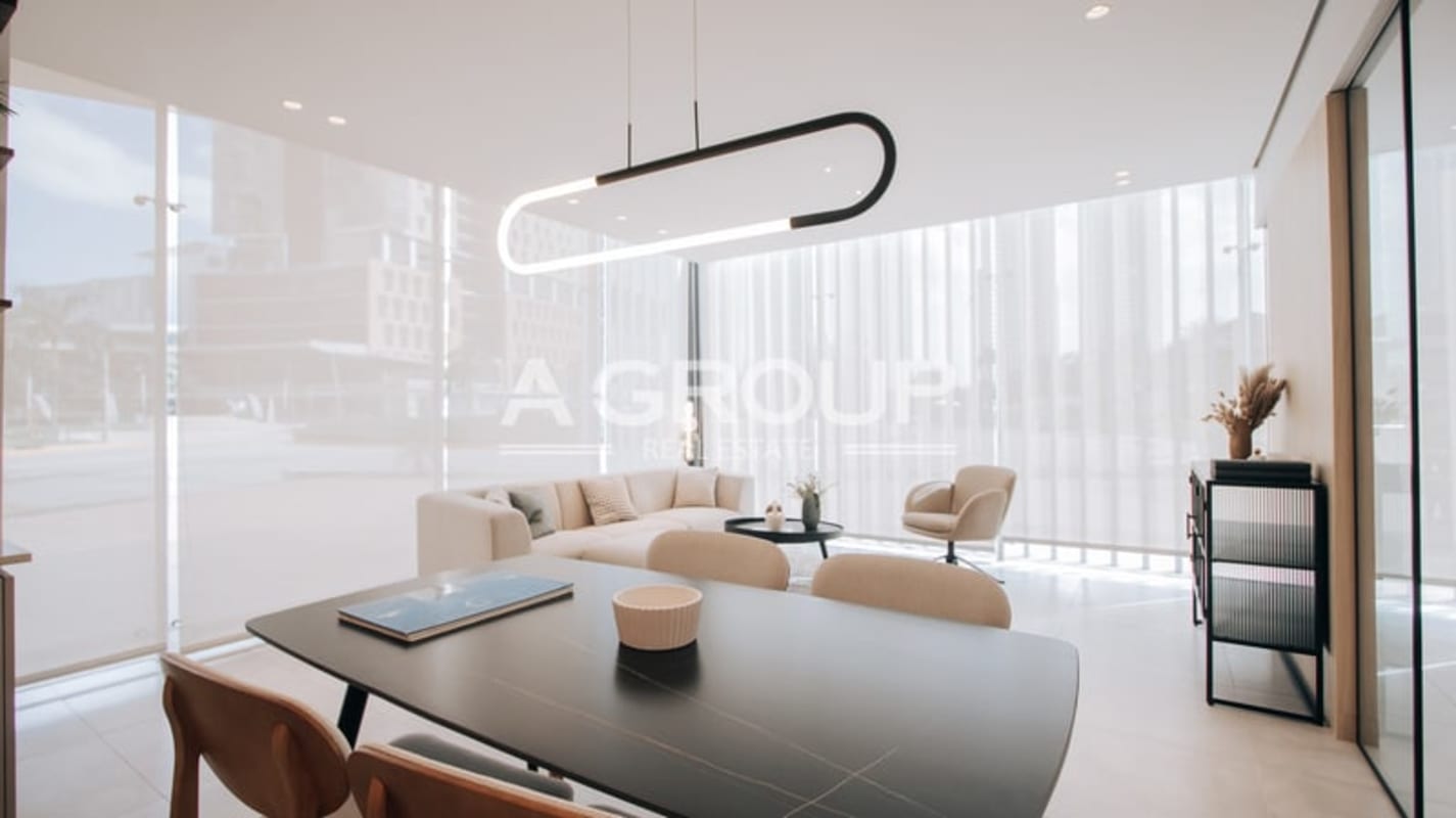 Sleek kitchen with contemporary wood cabinetry and appliances Generation Tower Costa del Este