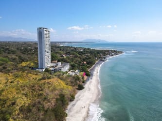Aerial of beachfront condominium tower PH El Palmar Residences on Playa El Palmar coast Panama