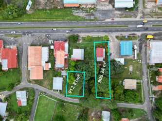 Aerial shot of flat green land for sale with boundary mark on Interamerican Highway La Paz Chame Panama