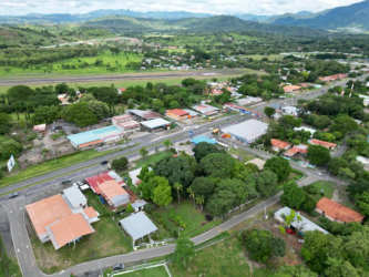 Aerial view of mixed residential and commercial town area with mountain background La Paz Chame Panama