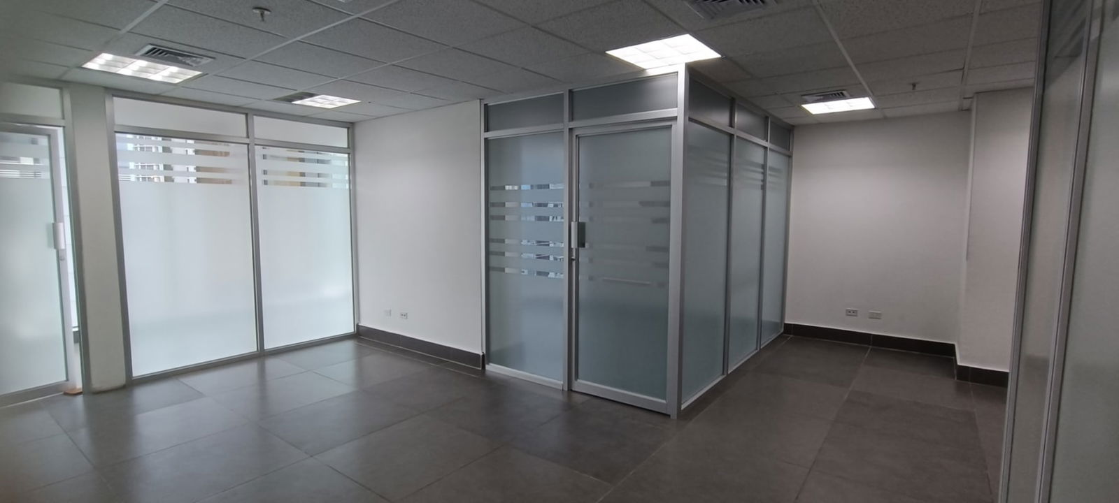 Private conference room with glass partitions inside PH Twist Tower Obarrio Panama
