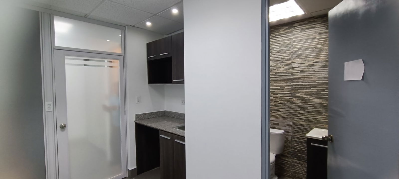 Bright reception space with glass wall partitions in PH Twist Tower Obarrio Panama City