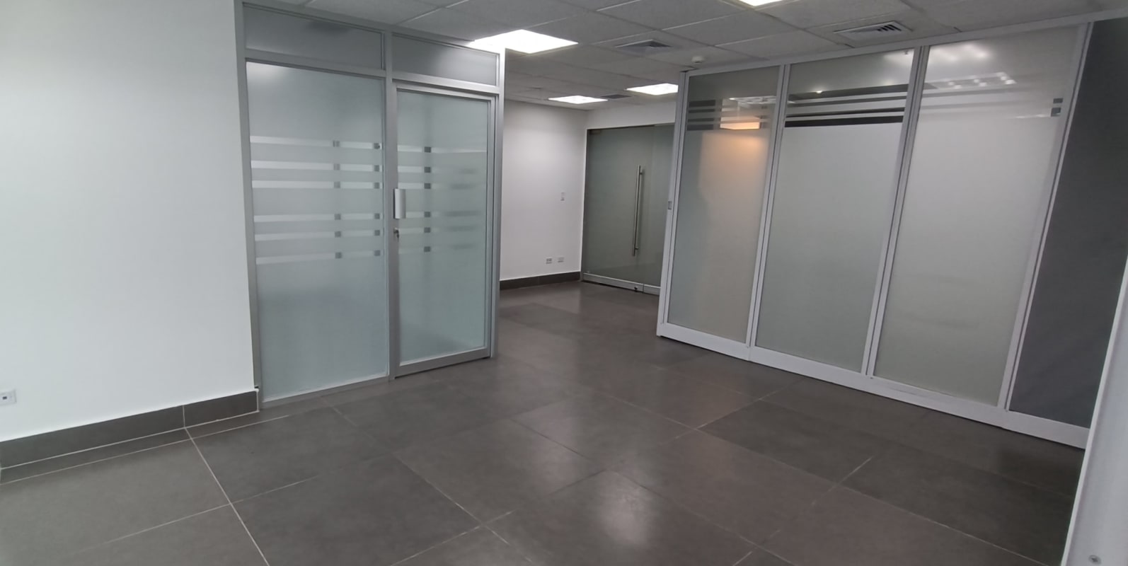 Glass entry door to finished modern office in PH Twist Tower Obarrio Panama City