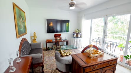 Living room with sofas, chandelier and classic decor in PH Tucan Country Club Panama