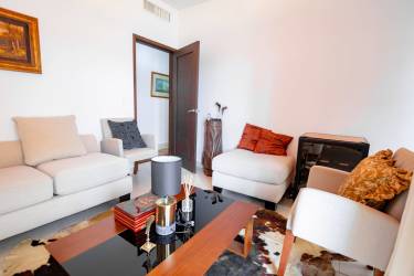 Bright hallway with tile flooring, wall art and natural light at PH Tucan Country Club Panama