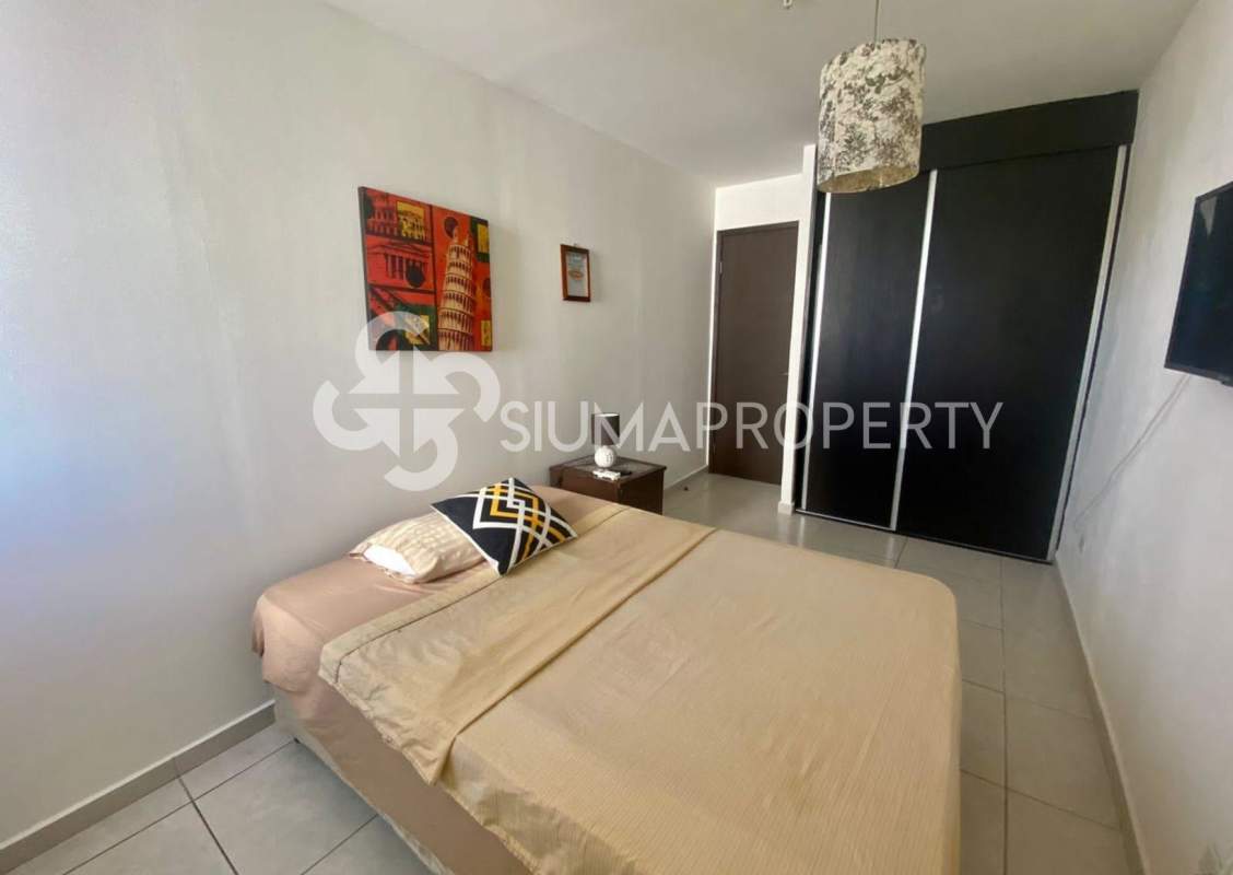 Dining area with panoramic windows ocean view at PH Bay View Panama City