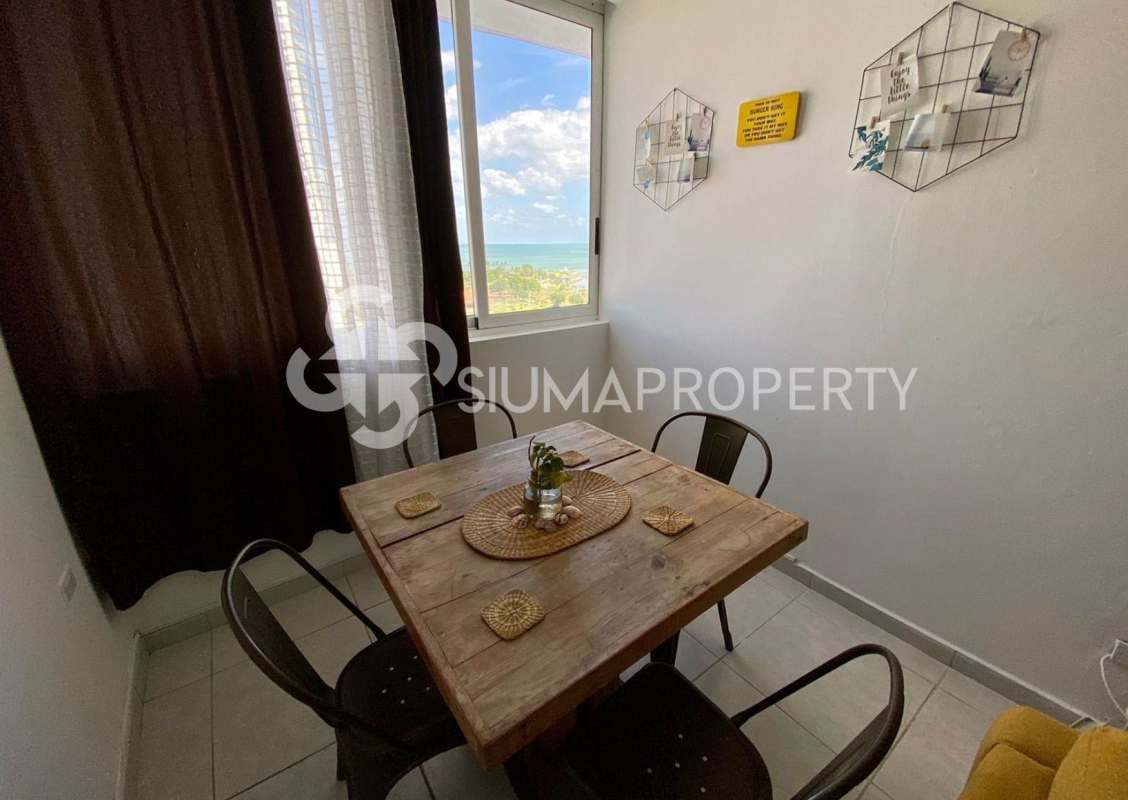 Modern kitchen with granite countertop, stove, fridge, microwave in PH Bay View Panama City