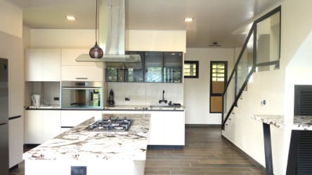 Large light-filled master bedroom suite with balcony mountain forest views in Altos del María Panama