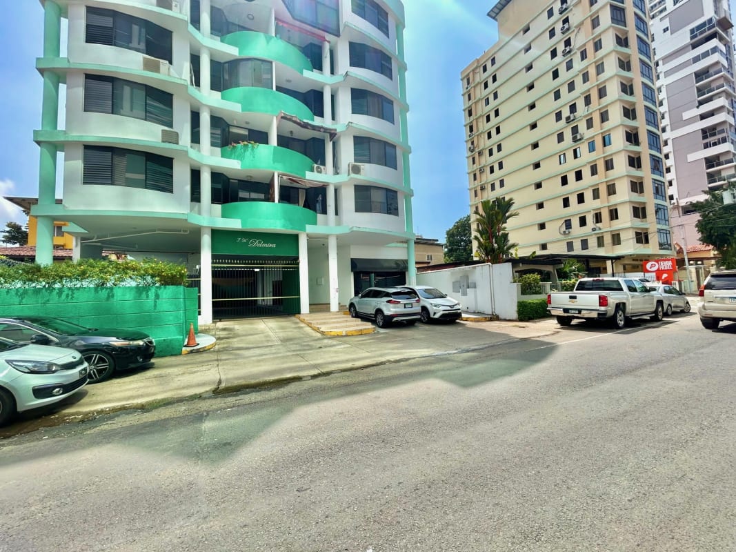 Open-plan workspace with fluorescent lighting, tiled floors, desks and reception in commercial space San Francisco