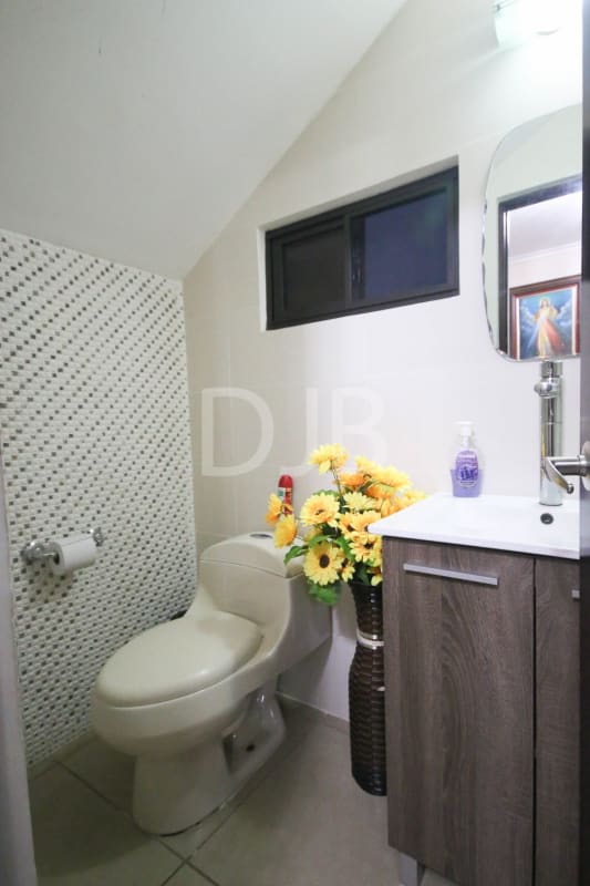 Kitchen with granite countertops, window light, wood cabinets in PH Mont Blanc Brisas del Golf