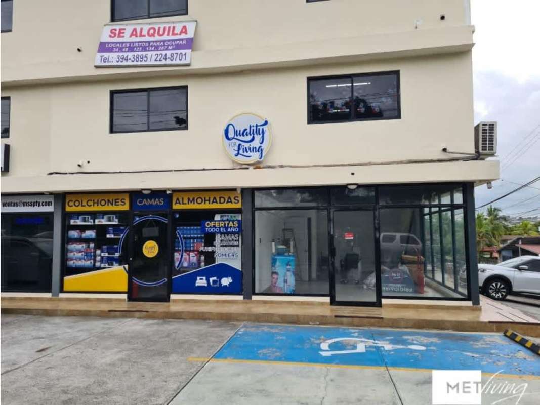 Street view of commercial storefront large windows and signage Parque Lefevre Panama City