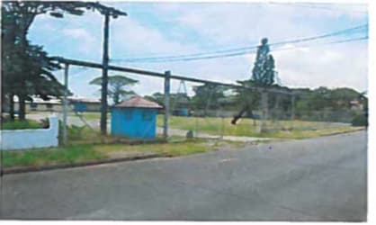 Entrances secured with fence and blue guard booth at industrial lot Tagaropulis Sabanitas Colón Panama