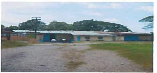 Single-story industrial warehouse with metal roofing and open yard in Colón Sabanitas Panama