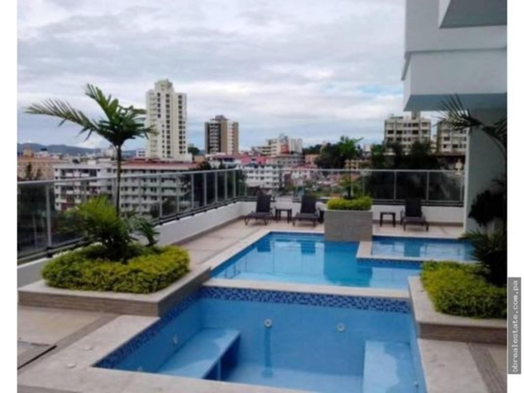 Jacuzzi adjacent to rooftop pool with lounge area in PH Belle View Bella Vista Panama City