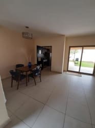 Kitchen with granite tops, dark cabinetry and stainless appliances in Woodlands house