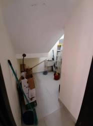 Bright bedroom with built-in wardrobe and ceramic tile floor in Panama Pacifico house