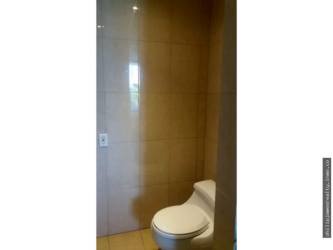 Modern tiled bathroom with glass enclosed shower Town Center Playa Blanca studio