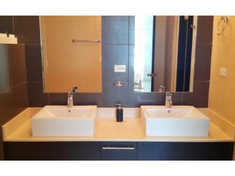 Spacious master bedroom with natural light and pool view in Playa Blanca resort condo Panama