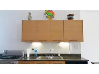 Modern kitchen with appliances and granite stone accents Playa Blanca Condo Panama