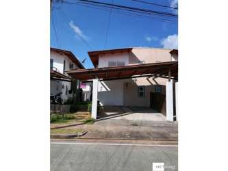 Two-story duplex house with carport and front lawn in PH La Campiña Arraiján Panama