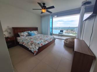 Master bedroom with balcony access and Pacific Ocean view at PH Bahia Resort Nueva Gorgona Panama