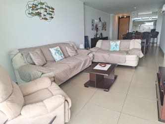 Bright living and dining area with ocean views in PH Bahia Resort beachfront condo Nueva Gorgona