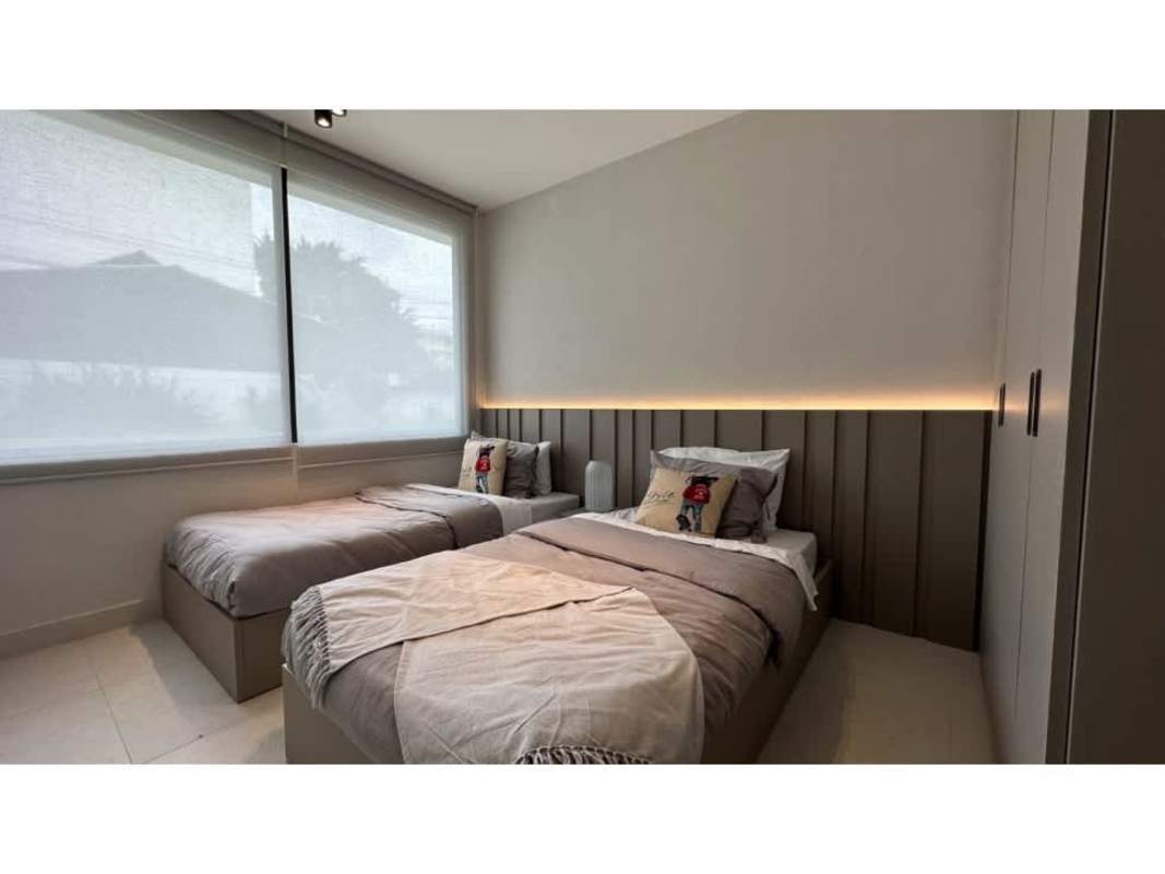 Bright living area with large windows and skyline views at 5Cero4 Park Residences Coco del Mar Panama