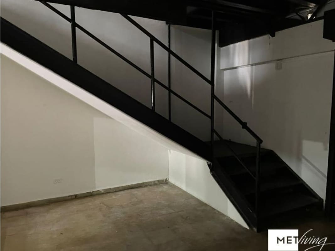 Simple bathroom with sink and toilet inside commercial space Plaza Carolina Panama