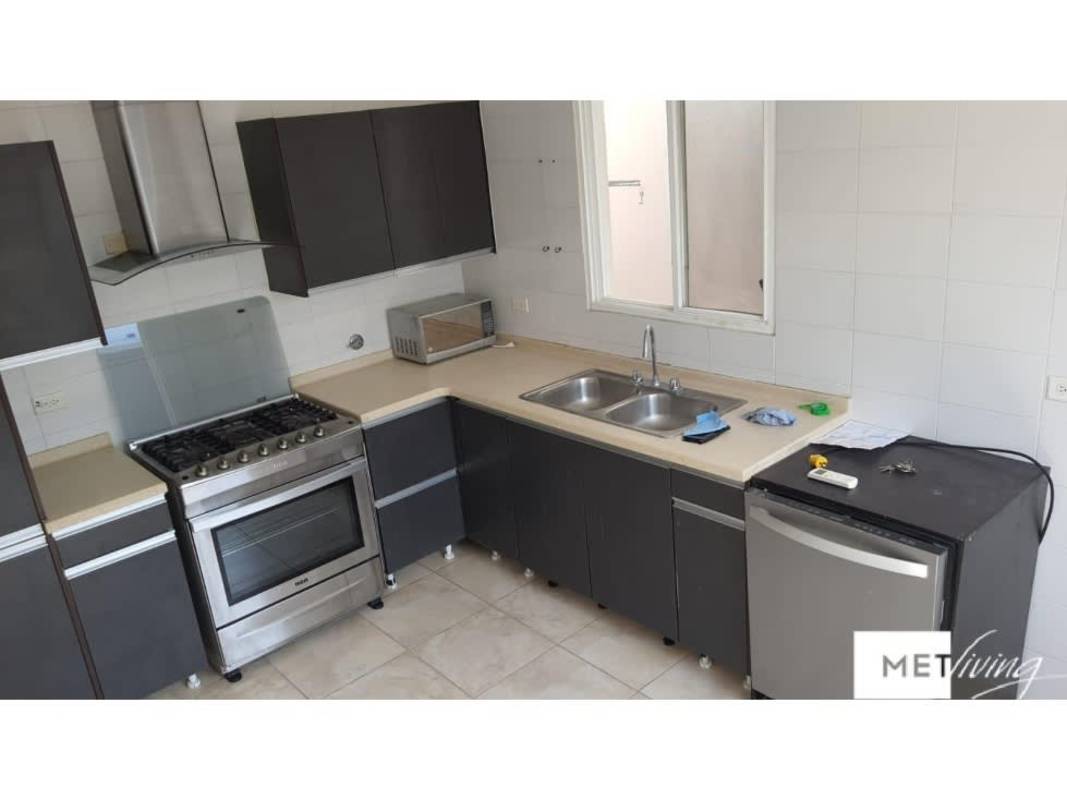 Modern kitchen with wood cabinets ceramic backsplash PH Everest Panama