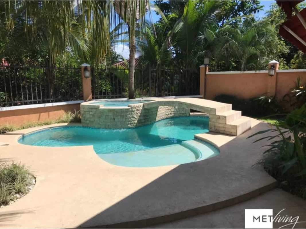 Backyard pool with attached spa, waterfall, garden and privacy fence Clayton Village Panama