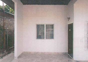 Covered porch front of single-story house with column detail in Soná Veraguas Panama for sale by Hola Realty
