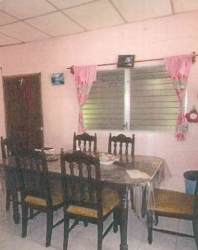 Large fenced backyard with trees at Soná Veraguas Panama property for sale Hola Realty