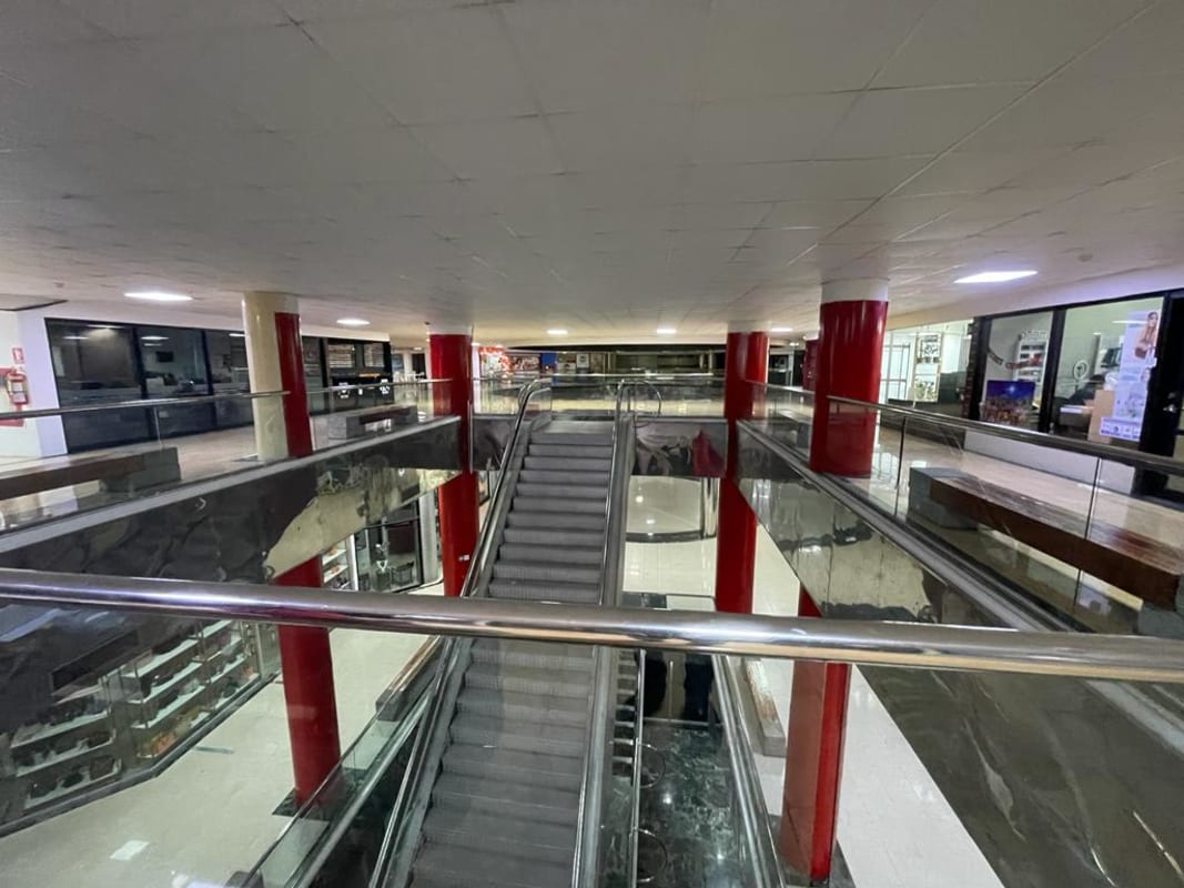 Shopping mall escalator and glass railings in Punta Paitilla Panama City commercial center