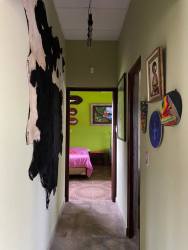 Open living area in Bejuco Chame house with French doors to pool patio Panama