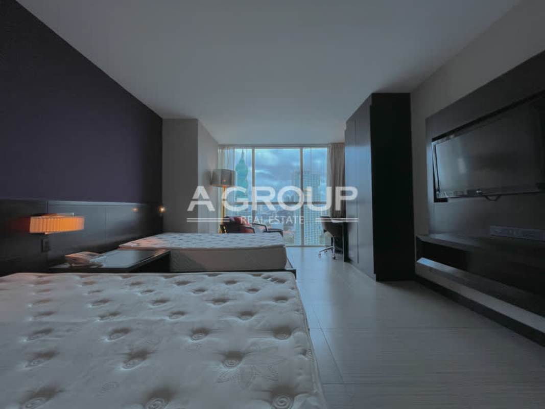 Fully furnished hotel suite with beds, TV, work desk in PH Megapolis Marriott Panama