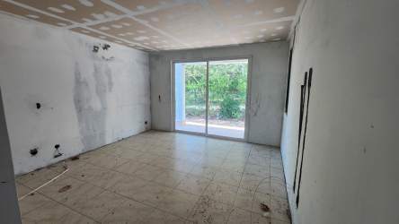 Unfinished beach villa exterior double garage unfinished facade Residencial Malibú Panama