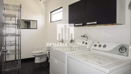 Living room with high ceiling and panoramic windows with countryside views in San Carlos Panama