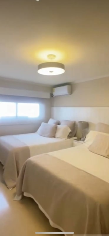 Modern living area with balcony overlooking Panama City PH Carmel