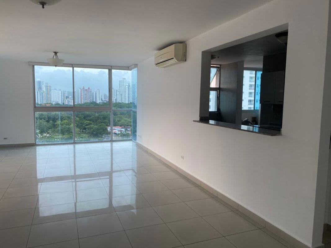 Spacious kitchen with white cabinetry, granite counters and appliances at PH Regent San Francisco Panama