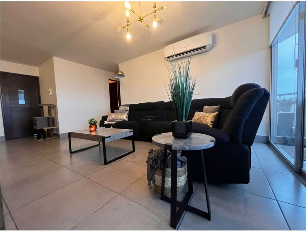 Kitchen with granite counters, cabinets, gas stove, laundry zone in PH Parques del Carmen Panama City