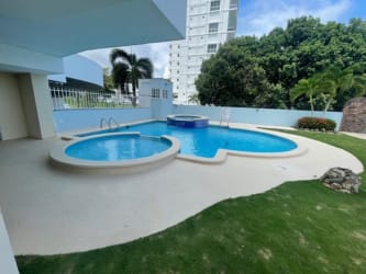 Traditional kitchen with granite countertops, wood cabinets, and appliances PH Miramar Farallon