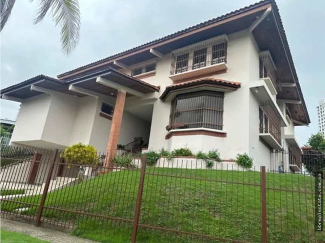 Two-story house with balconies bay window tile roof in Altos del Golf Panama