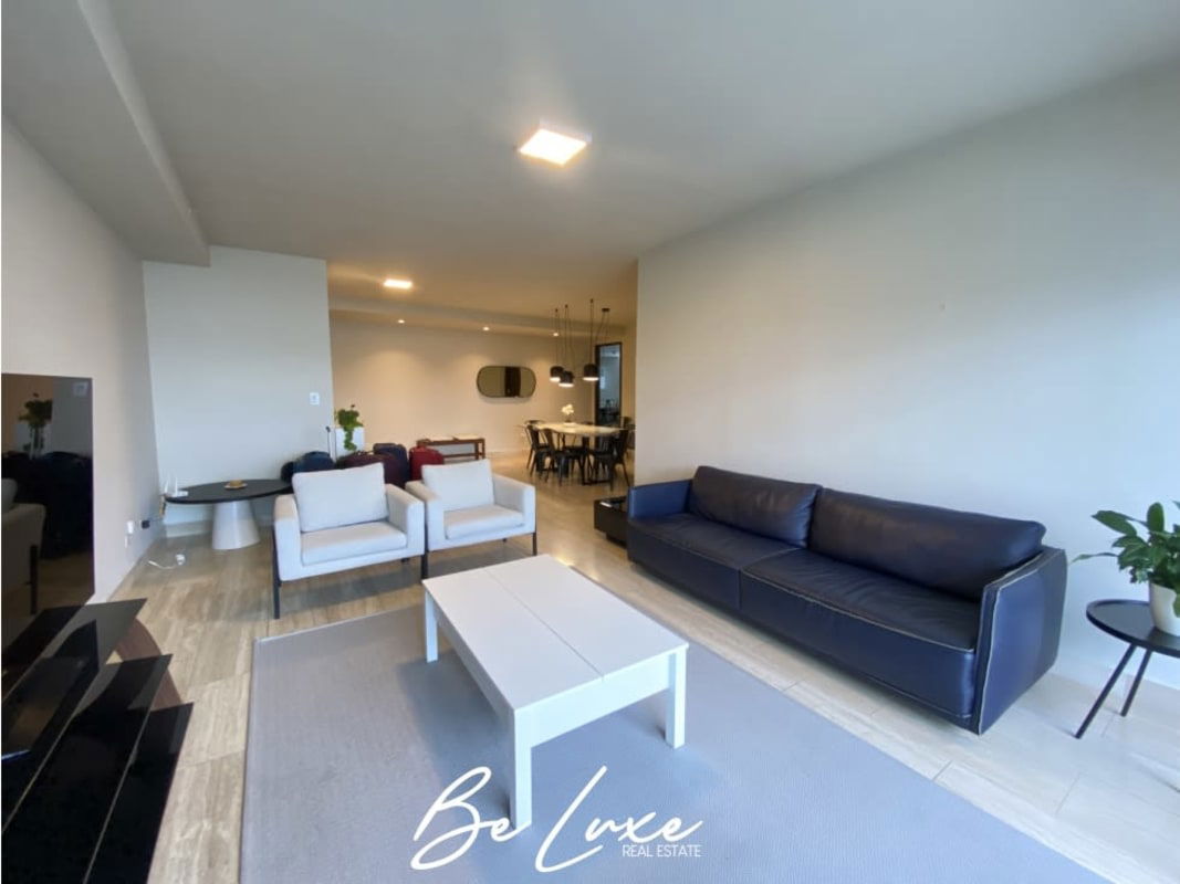 Open modern living and dining room with panoramic city view in PH The Regent Costa del Este Panama