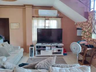 Small balcony with wrought iron railing overlooking neighborhood in Terronal David Panama house