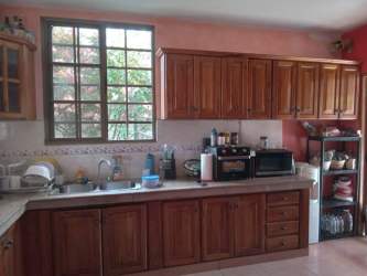 Living room features decorative ceiling chandelier curtains Terronal David house Panama