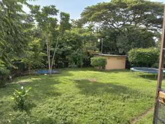 Living room with large window air conditioning light-colored sofa Terronal David house Panama