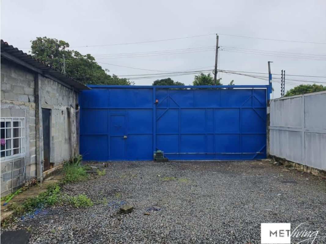 Open gravel yard with core commercial infrastructure in Panama City Villa de las Acacias area