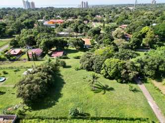 Aerial countryside view with farmland, greenery, and distant mountains near Nueva Gorgona Panama