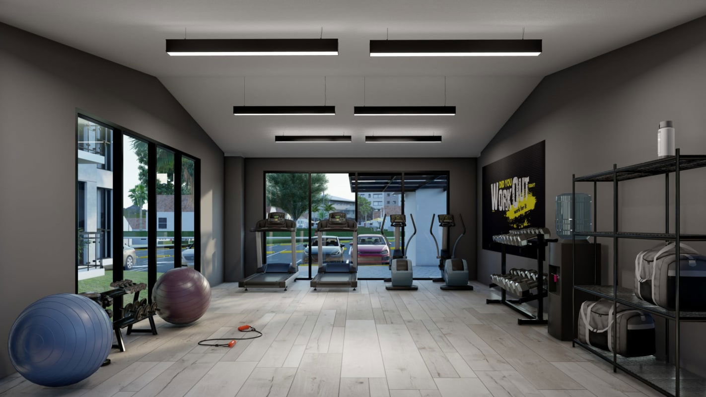 Modern apartment gym with equipment large windows motivational art PH Parque Las Acacias Don Bosco Panama